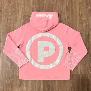 Detailed macro view of white spider web print on pink hoodie sleeve cuffs and foam lettering