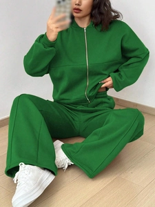 Detail of green long-sleeved zipper hoodie and wide-leg drawstring pants set