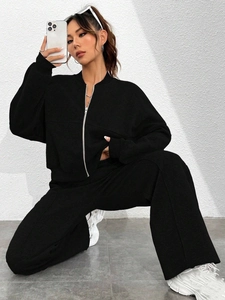 Women's black 2-piece tracksuit with zip-up jacket and wide-leg trousers in a minimalist set