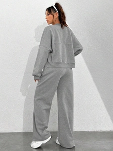 Detailed back view of a grey casual two-piece tracksuit featuring loose wide-leg joggers