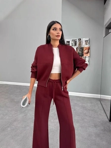 Women's burgundy tracksuit set featuring a zip-up stand collar jacket and wide-leg sweatpants