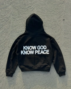 Detailed back view of a black street-style hoodie with white KNOW GOD KNOW PEACE print