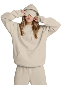 Detail of cream oversized hoodie set featuring built-in eye mask and kangaroo pocket