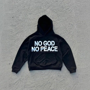Oversized black hoodie with NO GOD NO PEACE print and kangaroo pocket flat lay
