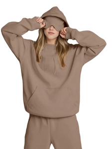 Detail of mocha brown hoodie set featuring built-in eye mask and soft fleece fabric texture