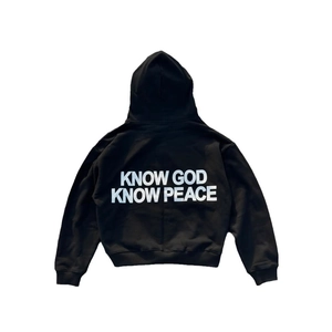 Black oversized hoodie featuring Know God Know Peace back print in a minimalist flat lay