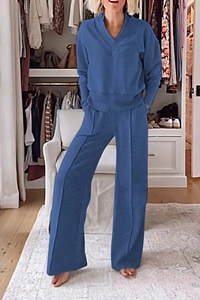 Detail of blue casual two-piece set featuring V-neck long sleeve top and wide-leg pants