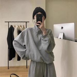 Women's casual grey two-piece tracksuit with half-zip sweatshirt and matching sweatpants