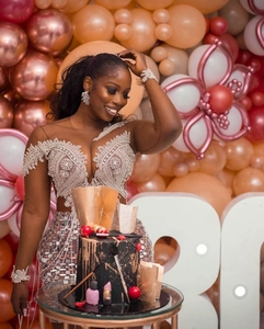 Detail of sequin evening dress featuring silver beads and faux pearl embroidery