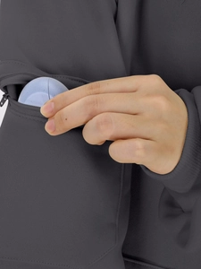 Detail of hidden zipper sleeve pocket on charcoal hoodie with storage for small gadget