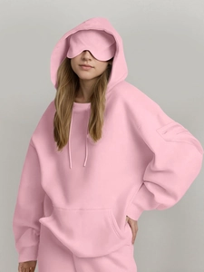Pink oversized hoodie featuring a built-in eye mask and functional sleeve zipper pocket