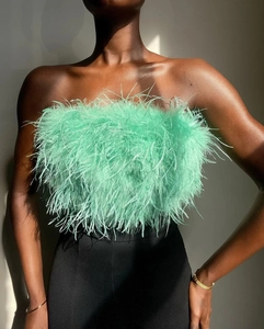 Detail shot of mint green feather tube top showcasing soft texture and fluffy volume