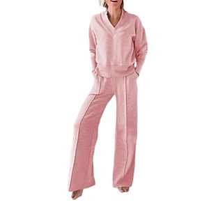 Women's pink lounge set featuring V-neck long sleeve top and wide leg pants in soft knit