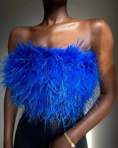 Detailed view of royal blue faux feather tube top with elegant gold chain accessory