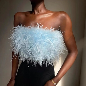 Light blue faux ostrich feather tube top for women styled with black pants and gold jewelry