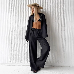 Women's 3-piece linen set with black oversized shirt, wide-leg trousers and bikini top