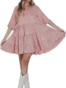 Detail view of the tiered ruffle hem and sparkling pink sequins on the babydoll dress