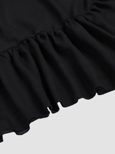 Elegant black ruffle mesh evening gown detail with flowing tiered chiffon skirt hem