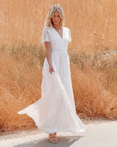 Close-up of deep V-neckline with delicate eyelash lace trim on a white tulle wedding dress