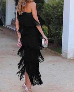 Detail shot of tiered black fringes on a maxi dress for elegant evening events