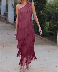 Detail of wine red one-shoulder dress showing multi-layered fringe texture and movement