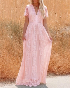 Detail of V-neck light pink lace dress featuring hollow out waist and bell sleeves