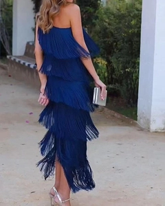 Detailed side view of navy blue layered fringe dress with asymmetrical tassel design