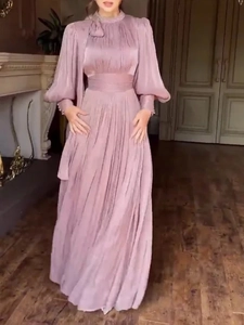 Elegant long-sleeve pleated evening dress in dusty pink with a high neck and wide waistband