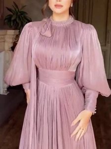 Elegant mauve long sleeve evening gown with beaded high neck and pleated skirt