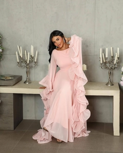 Detail of elegant light pink evening gown with voluminous multi-layered ruffles and tulle