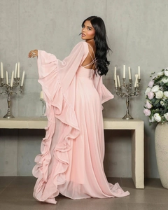 Pink evening gown featuring elegant backless crisscross straps and tiered ruffle sleeves