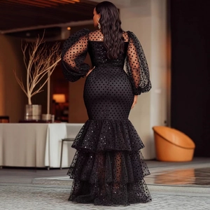 Elegant black fisheye evening dress with puff sleeves and velvet polka dots glitter
