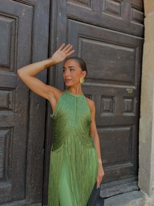 Detailed view of grass green fringe halter maxi dress with dynamic tassels and golden jewelry