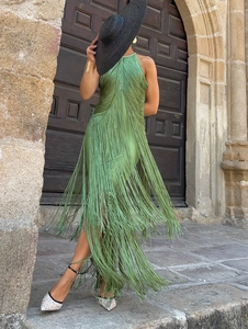 Detail of green halter neck maxi dress featuring intricate long flowing fringe layers