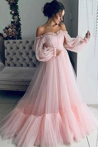 Detail view of pink off-shoulder gown featuring puff sleeves and floral lace applique