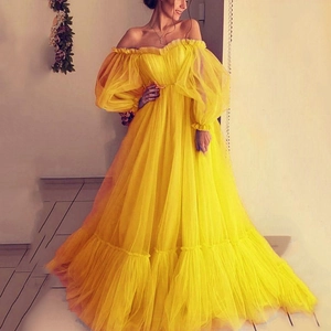 Elegant yellow off-shoulder tulle ball gown with puff sleeves for formal parties