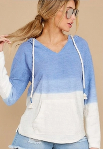 Detail view of blue and white color-block hoodie with kangaroo pocket and drawstring hood