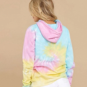 Macro view of the colorful tie-dye patterns and ribbed texture on this casual hoodie