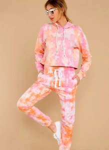 Pink and orange tie-dye loungewear set with cropped hoodie and drawstring sweatpants