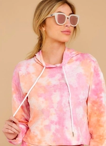 Women's pink orange tie-dye drawstring hoodie with stylish white sunglasses
