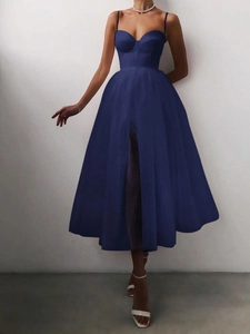 Detailed view of the slim shoulder straps and bodice on a navy blue evening gown