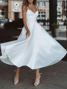 Elegant white satin midi dress with V-neck straps and a flowing large swing skirt