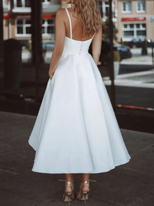 Elegant white satin A-line midi dress with spaghetti straps and button back detail