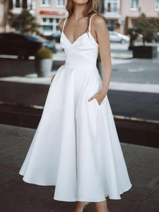 Elegant white sleeveless V-neck satin midi dress with A-line skirt and side pockets