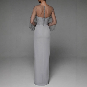 Elegant grey bodycon maxi dress featuring sheer mesh sleeves and back button detailing