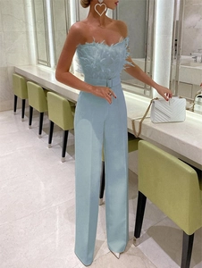 Elegant light blue strapless jumpsuit featuring feather trim and matching waist belt