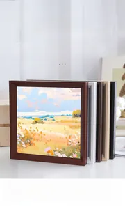 Close-up of minimalist square wooden frames in walnut, white, natural, and black colors