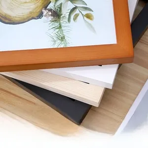 Close-up of minimalist pine wood frames in black, white, natural, and brown finishes
