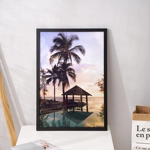 Modern black wooden frame featuring a tropical beach sunset print for home wall decor