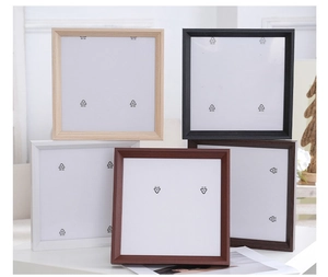 Detailed view of square wooden frames in five different colors including light wood and black